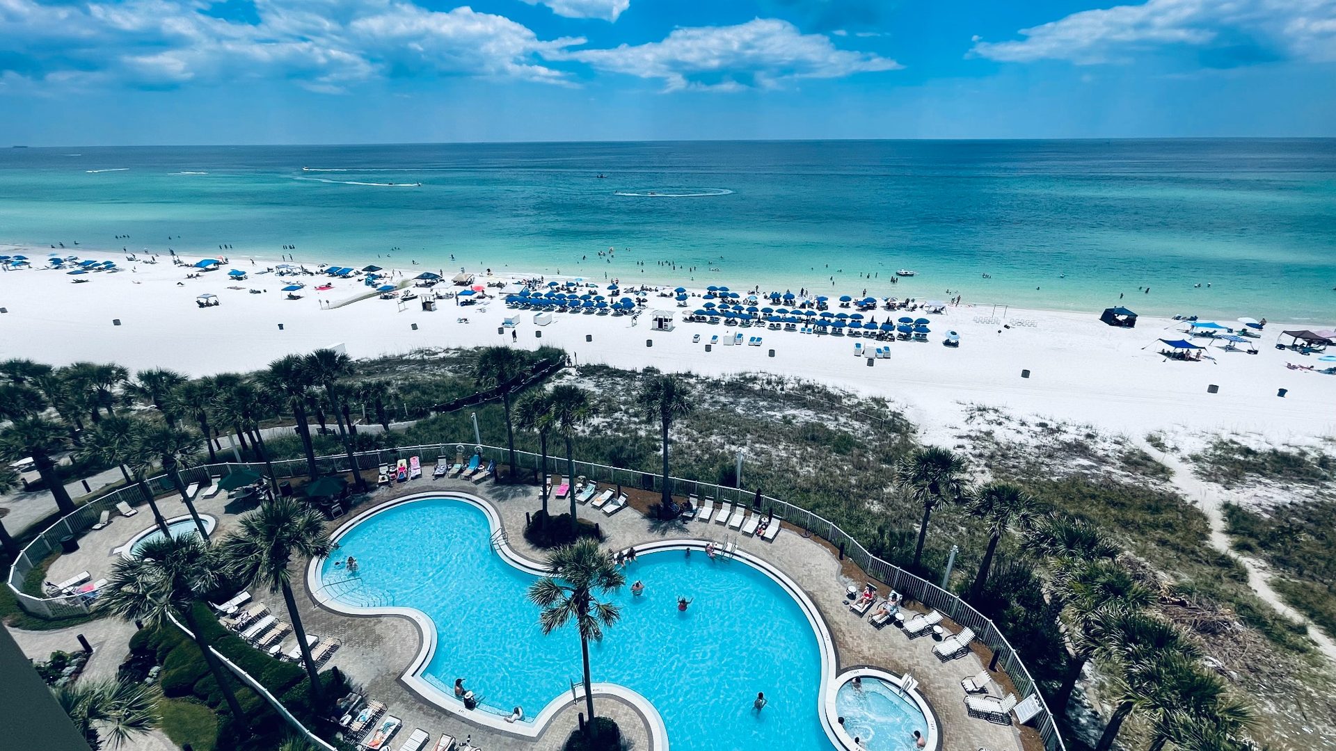 Panoramic beach and resort pool view